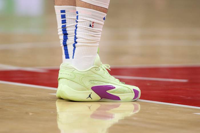 Dallas Mavericks guard Luka Doncic's green and purple Jordan Brand sneakers.